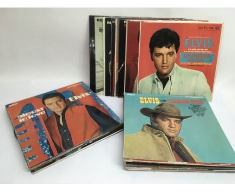 A collection of Elvis Presley LPs.