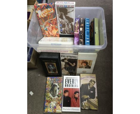 A box containing various CD box sets including Bob Dylan, Sandy Denny, Ray Charles, Elmore James and others.