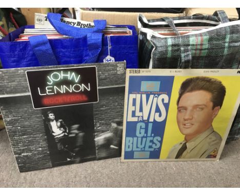 Two bags of LPs by various artists inlcuding Elvis Presley, Beach Boys, John Lennon and others.