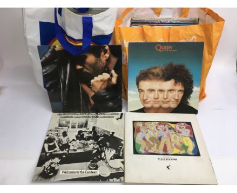 Two bags of rock and pop LPs and 12 inches by various artists including The Hollies, Michael Jackson, The Who, Queen and othe