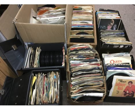 A large collection of 7 inch singles by various artists including Elvis Presley, Queen, The Animals and others.