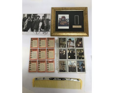 A collection of pop memorabilia including an incomplete set of trading cards for The Beatles, a limited edition framed film c