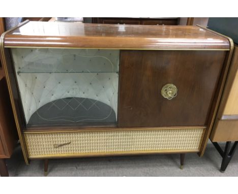 A vintage Weimar sideboard stereo cabinet enclosing a radio, record player and drinks compartment.Approx 41x109x94cm high