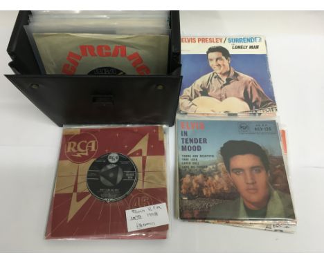 A record box of eighty plus Elvis Presley 7 inch singles and EPs including many RCA silver spot examples.