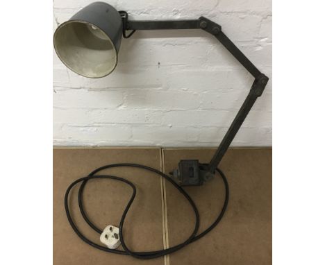A metal industrial lamp with adjustable arm