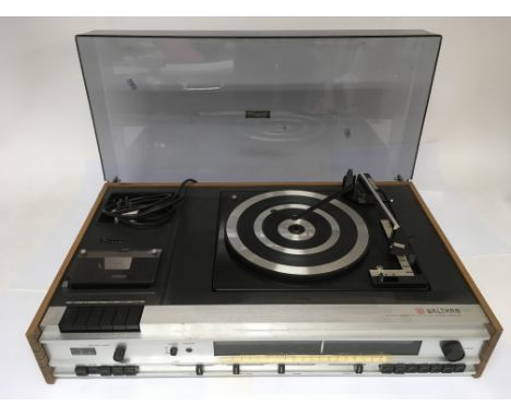 A Waltham STM 30 music system featuring a record player, cassette player and stereo receiver. The turntable plays at 33, 45 a