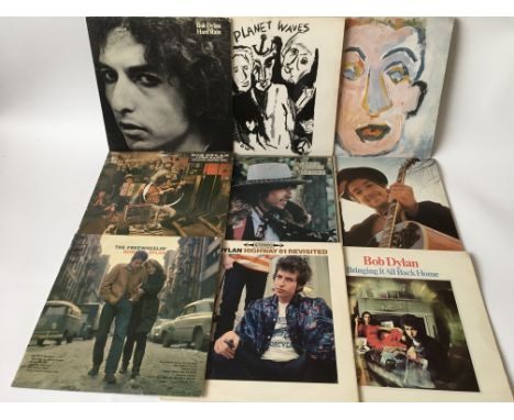 A collection of fourteen Bob Dylan LPs including 'Freewheelin', 'Another Side Of Bob Dylan', 'Highway 61 Revisited' and other