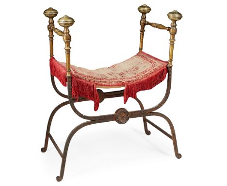 CONTINENTAL IRON AND BRASS CURULE CHAIR 19TH CENTURY with brass flattened knop finials, with a distressed red velvet cushion 