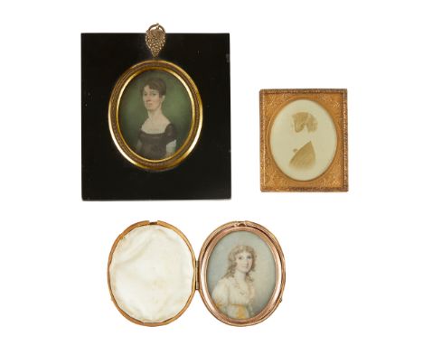 Y THREE PORTRAIT MINIATURES OF YOUNG LADIES LATE 18TH/ 19TH CENTURY comprising an OVAL WATERCOLOUR ON IVORY, the sitter with 