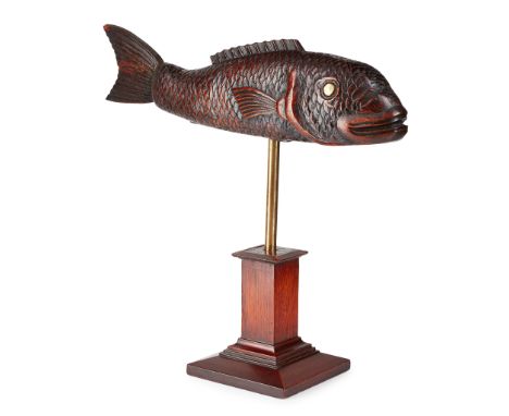 CARVED AND MOUNTED HARDWOOD FISH MODEL 19TH CENTURY carved with scales and set with brass button eyes, raised on a later bras