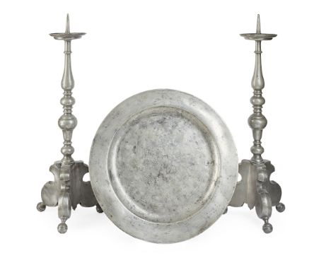 TWO PEWTER PRICKET CANDLESTICKS 18TH CENTURY the drip trays raised on knopped columns, with triangular bases with tripod base