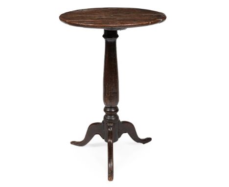 GEORGE II PROVINCIAL OAK CANDLE STAND EARLY 18TH CENTURY the circular top raised on a baluster column and flattened tripod le