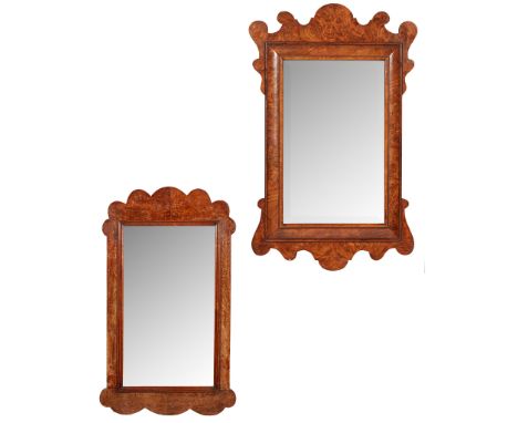 TWO EARLY GEORGIAN STYLE WALNUT MIRRORS EARLY 20TH CENTURY one with a bevelled mirror plate in a cushion moulded and scrolled