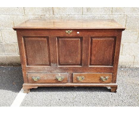 Oak Georgian-style mule chest&nbsp;with hinged plank top, above panelled front and sides and two drawers, on ogee bracket fee