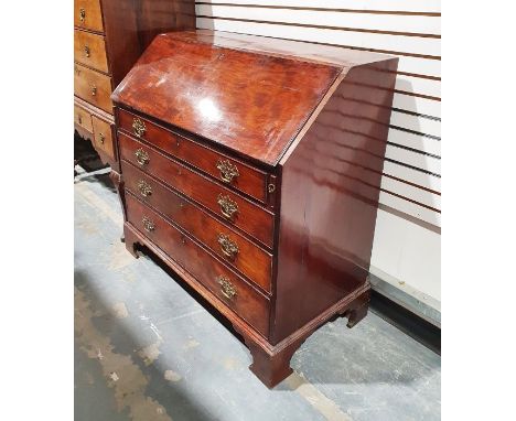 Georgian mahogany bureau, the fall front revealing an interior fitted with drawers, cupboard and pigeonholes, above four long