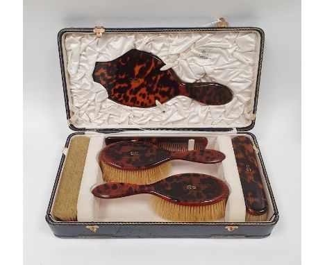 Asprey gold inlaid tortoiseshell dressing table set of six pieces viz:- hand mirror, pair hairbrushes, pair clothes brushes a