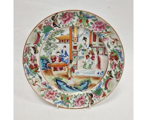 19th century Cantonese plate, painted in the famille rose palette, painted with figures in an interior and on terracing, with
