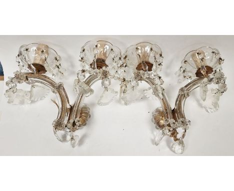 Pair of 20th century glass two-light wall sconces&nbsp;each with petal-shaped drip pans suspending faceted drops, issuing fro