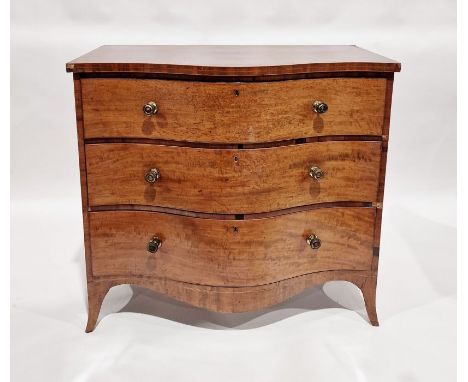 George III mahogany serpentine-fronted chest of three graduated drawers with circular brass stamped handles, on outswept brac