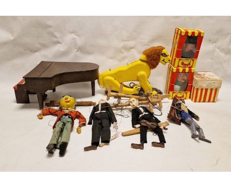 Two various papier mache and wood puppets, a painted wood grand piano with stool, a Pelham puppet of a clown, a yellow painte
