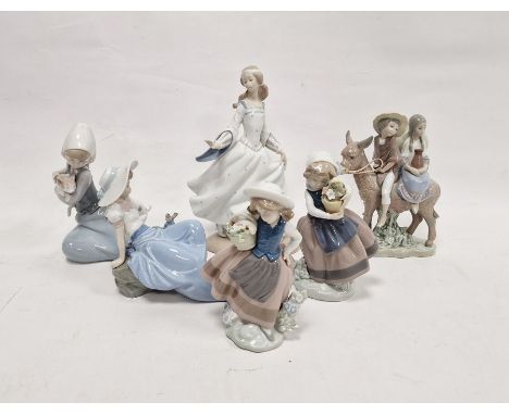 Five Lladro figures including a boy and girl riding a donkey, a pair of girls with baskets of flowers and another playing wit