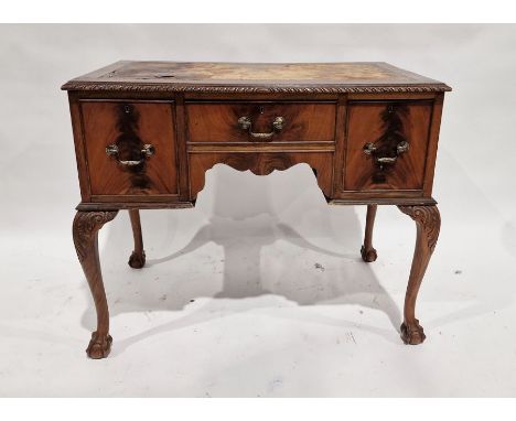 20th century mahogany kneehole desk with brown leather insert, on cabriole supports and claw and ball feet 76 h. x 91 x 52 cm