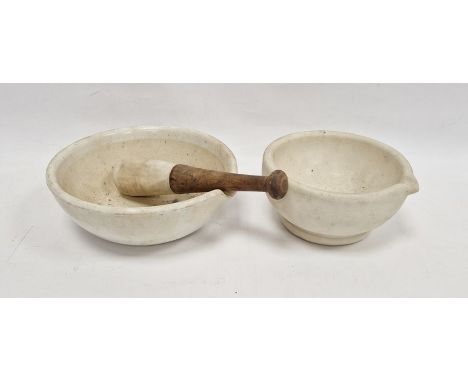 White stoneware mortar and pestle with wooden handle and another ceramic mortar Condition ReportLargest 26cm diameterother 21