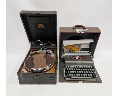 Imperial typewriter in grey, with brown carrying case and His Master's Voice portable gramophone player, with black carrying 