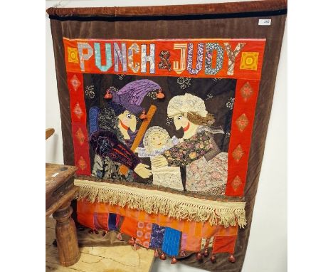 Punch and Judy applique and embroidered wall hanging, 84cm x 96cm and a puppet 'cut out' pattern print (framed and glazed), 7