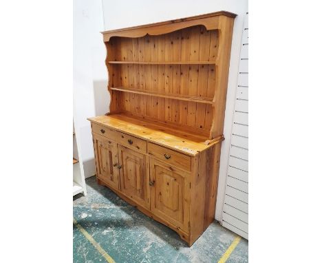 20th century pine dresser of two shelves over rectangular base, three short drawers over three cupboards to bracket feet h 18