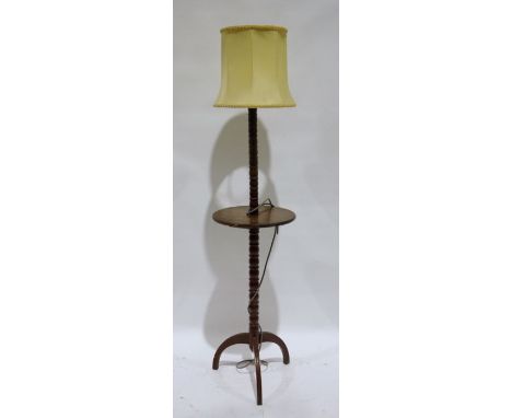 Early 20th century turned oak standard lamp with central tier on tripod base