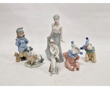 Four Nao figures and two others similar, printed brown marks, and impressed numerals, comprising two children dressed as clow