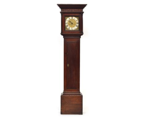 A George III oak longcase clock, moulded pediment over parquetry frieze, the 9 inch dial with Roman numerals to silvered chap