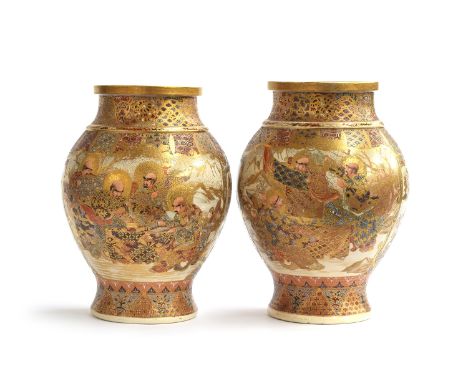A pair of Meiji period Japanese Satsuma vases, of baluster form, decorated with immortals and panels of flora and fauna, rais