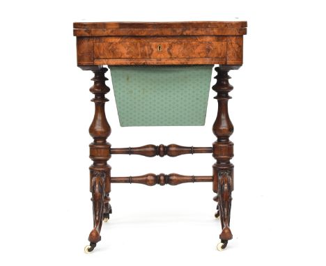 A 19th century burr walnut and marquetry games and work table, the shaped foldover top opening to reveal a chess and backgamm