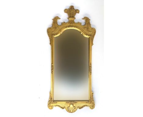 A George II style giltwood wall mirror, 20th century, the cresting centred by three feathers and flanked by eagle's heads on 