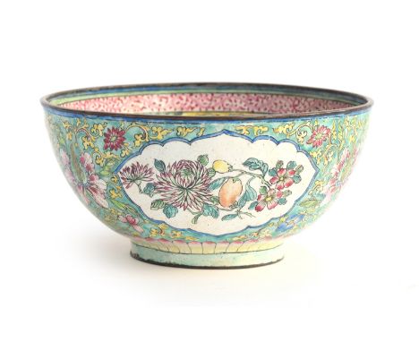 A Chinese Canton enamel on copper famille rose bowl, central panel depicting pomegranates on a yellow frieze ground surrounde