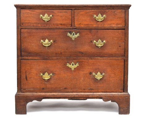 A small George III and later oak chest of two short over two long drawers, on bracket feet, 80cm wide, 54cm deep, 76cm high 