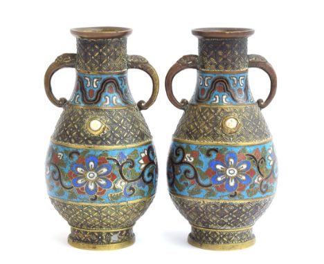 A pair of Japanese brass and champleve enamel twin handled vases, 18.5cm high 