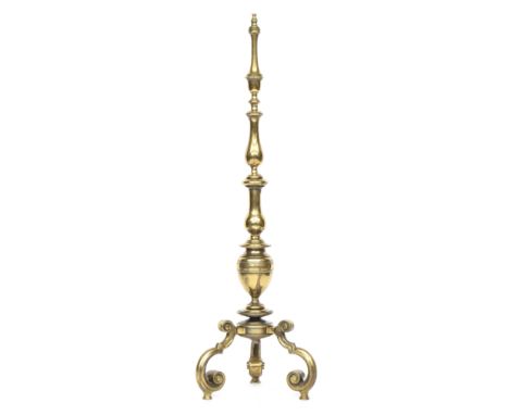 A heavy brass standard lamp, the turned column on three scrolling legs, 135cm high 