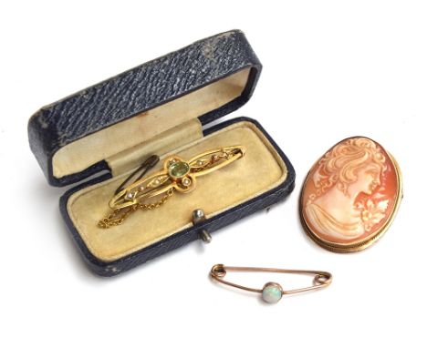 An Edwardian 9ct gold bar brooch set with seed pearls and a peridot, approx. 2.4g, boxed; together with a small gold opal bar