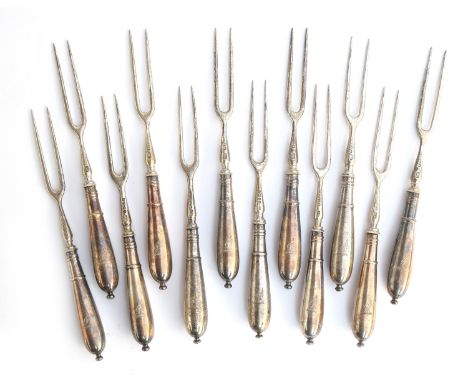 A set of twelve Victorian silver two pronged forks by Harrison Brothers & Howson, Sheffield 1883, the handles engraved with a