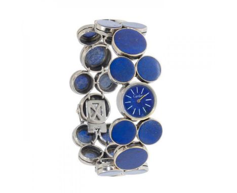 CARTIER watch, 70s, n. 19056, bracelet model 20819, for women.In white gold and lapis lazuli. Case and dial in circular lapis