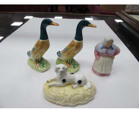 Royal Worcester Candle Snuffer as a Housewife, her right hand on pocket, left on waist, 6.5cm high, puce backstamp; two ceram