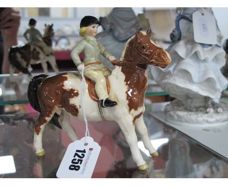 Beswick Pottery Girl on Pony, model no 1499 (Skewbald) (light crazing), 13.5cm high.