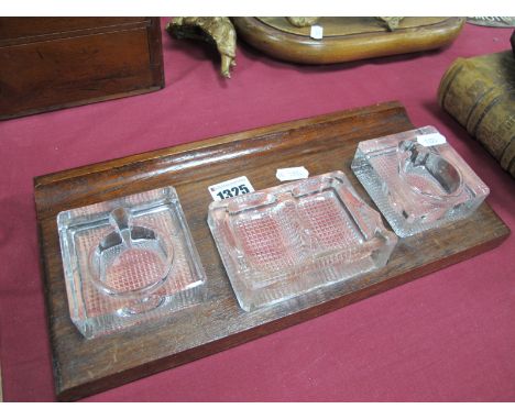 A Circa 1930's Oak Desk Set, featuring two glass inkwells, central double pipe rest and inset pen rest.