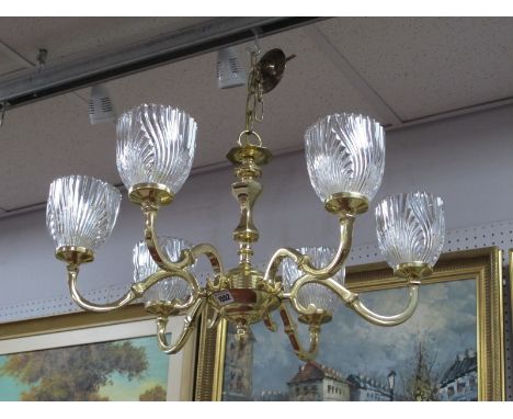 A Late XX Century Brass Chandelier, six branches supporting decorative ribbed glass shades.