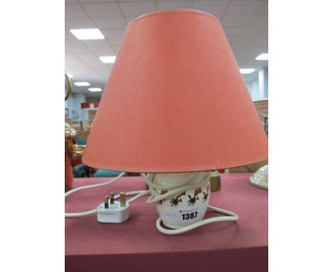 Guinness Pottery Lamp, featuring eleven toucans on white ground, 8.5cm high, excluding fittings and shade.