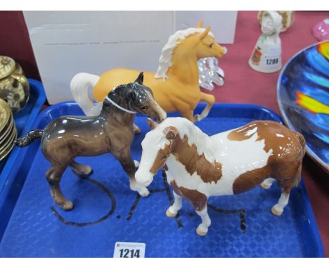 Beswick Pinto Pony, in brown and white, 16.5cm high; matt light brown Prancing Horse, with white mane and tail; Foal, 15.5cm 