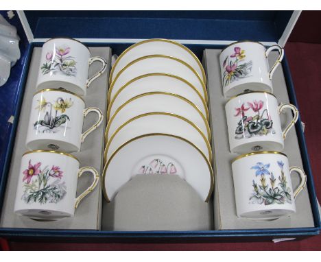 Royal Worcester Coffee Cans and Saucers, decorated with flowers, in fitted case.